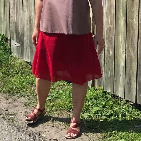Please look very closely here - this is a single Light Weight Cotton Slip in Deepest Red. You can just barely make out the outline of the black pair of Knicker-Slips the model wears underneath :-) The top is the colour amethyst.