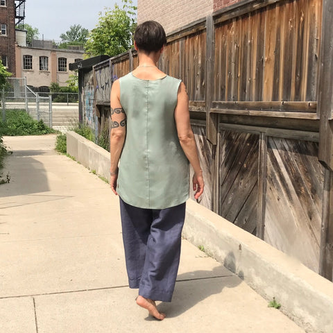 Model is 5'5.5" or 166cm | SLEEVELESS TUNIC Colour/Size/Length: Sage/Medium/Longer | TOWN PANT Colour/Cut/Length: Steel Blue/Regular/Length 1 